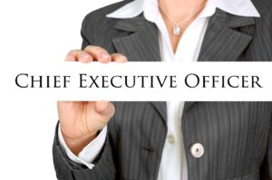 a businesswoman holding a title with the words "Chief Executive Officer"