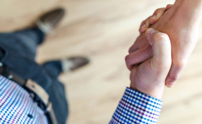 two people shaking hands